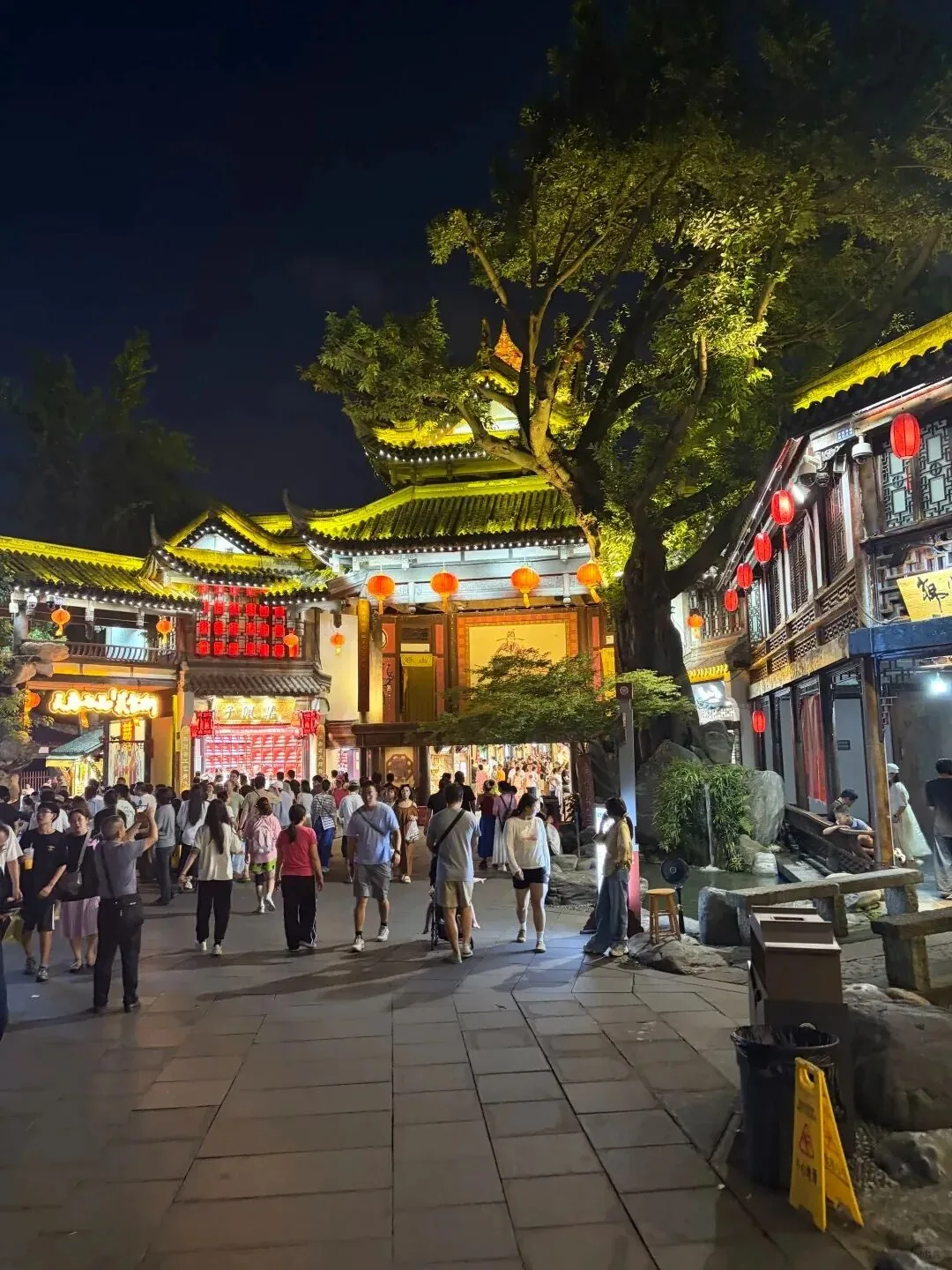 Ancient-style Jinli night market street with lanterns at dusk
