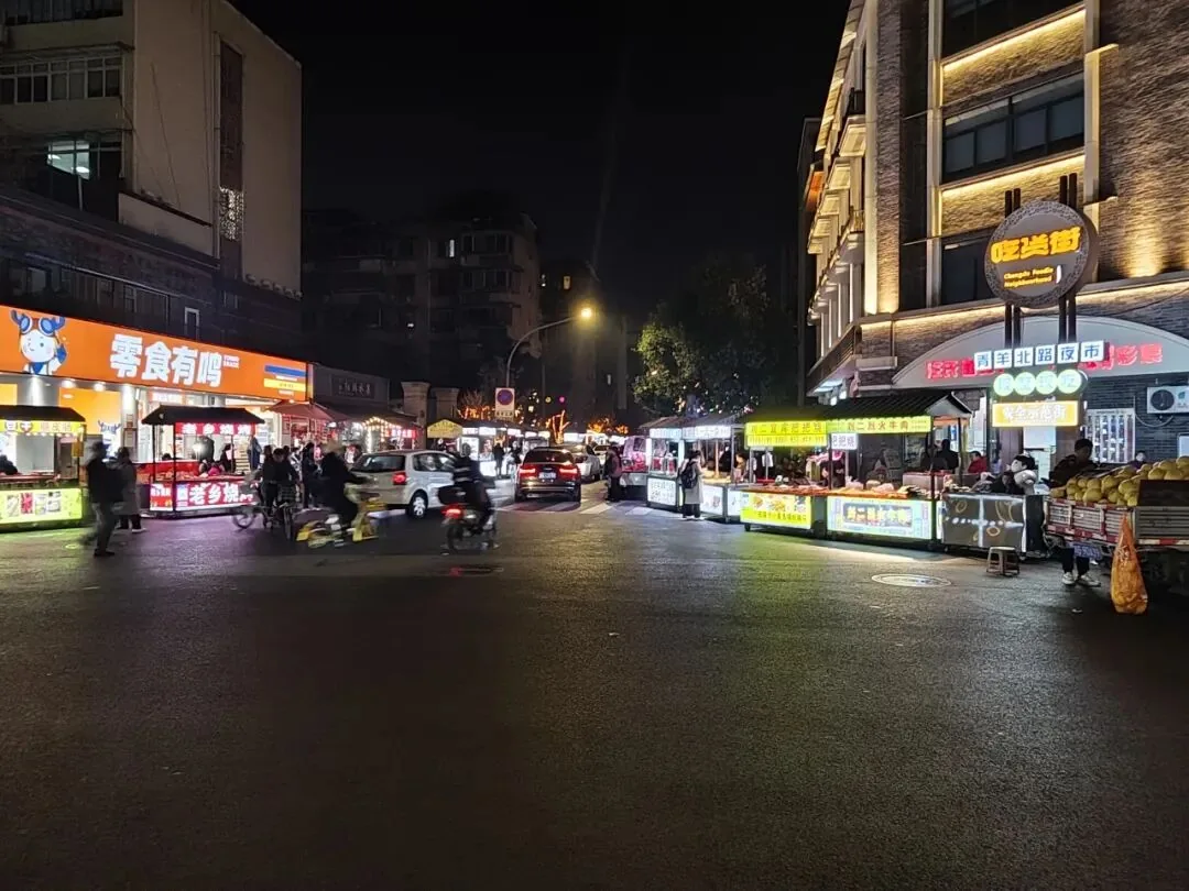 Trendy storefront with night lights on Xi'an Road, Jinniu District Chengdu