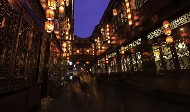 Jinli Ancient Street glowing at dusk, perfect evening stop after Wuhou Shrine