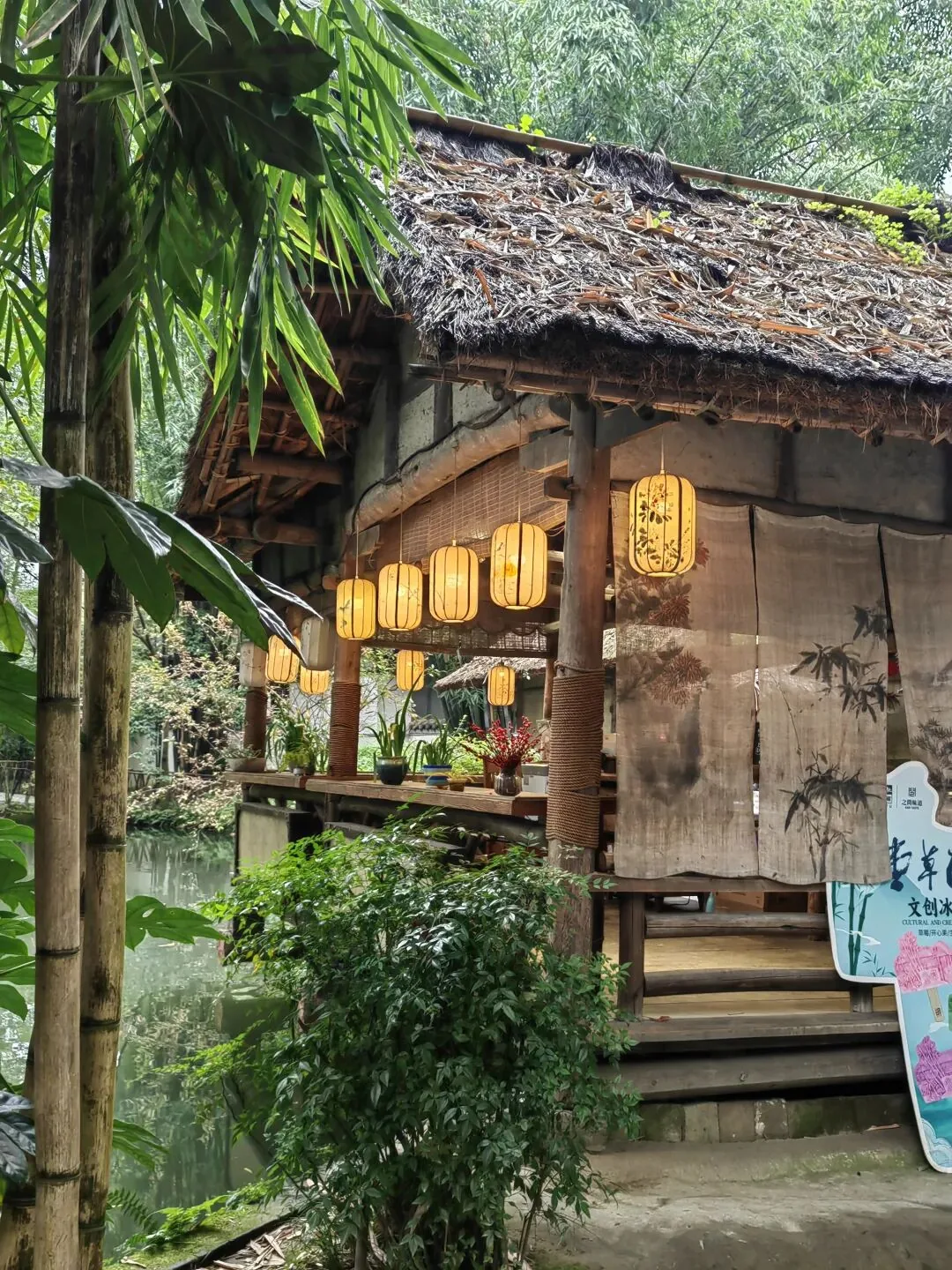 Bamboo-lined path and stream within the scenic Du Fu Thatched Cottage garden