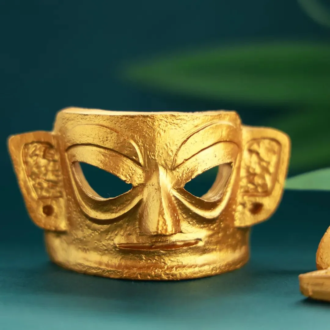 Gold mask fridge magnet souvenir with metallic finish and fine details