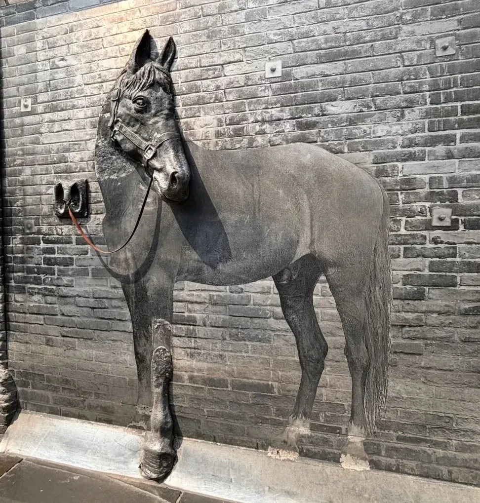 Original red sandstone horse-hitching posts along Zhai Alley in Kuanzhai Alley