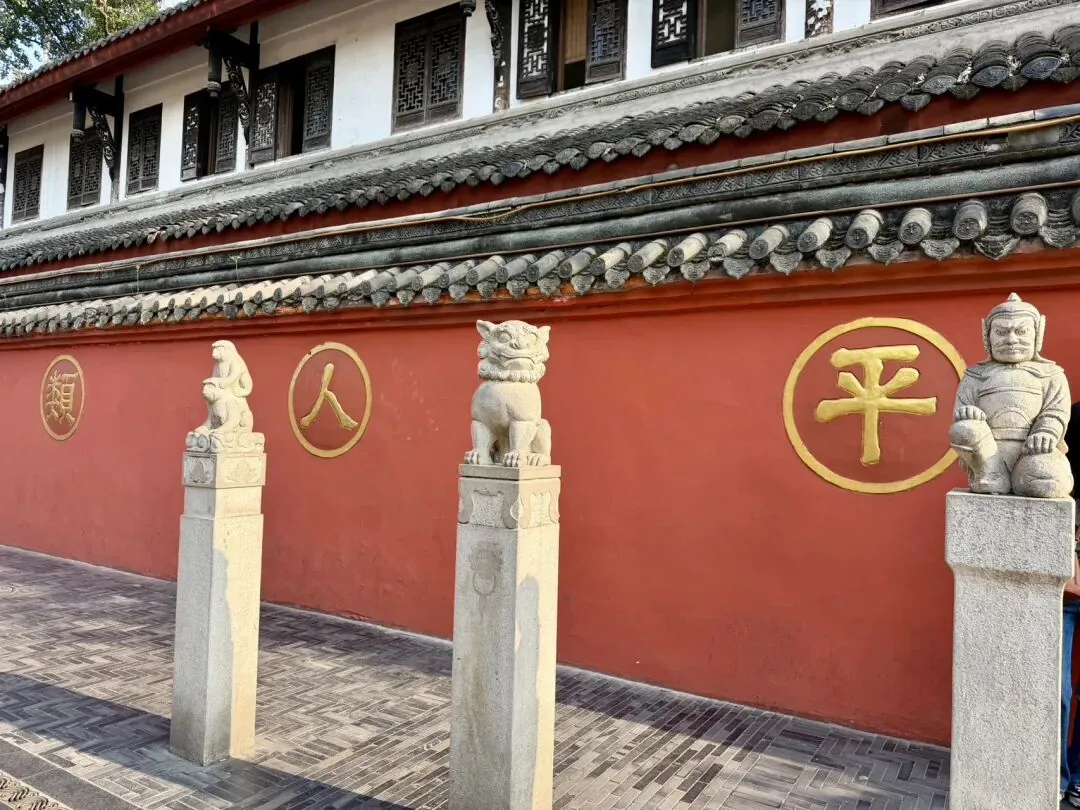Wenshu Monastery's historic halls and green courtyard with ancient trees
