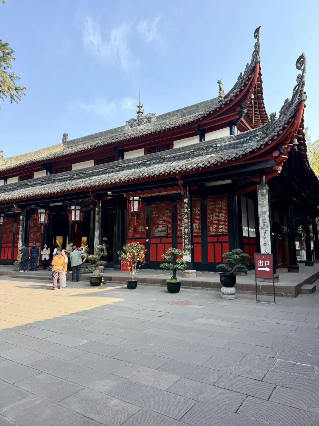 Spacious courtyard of Wenshu Monastery with bell tower and prayer halls