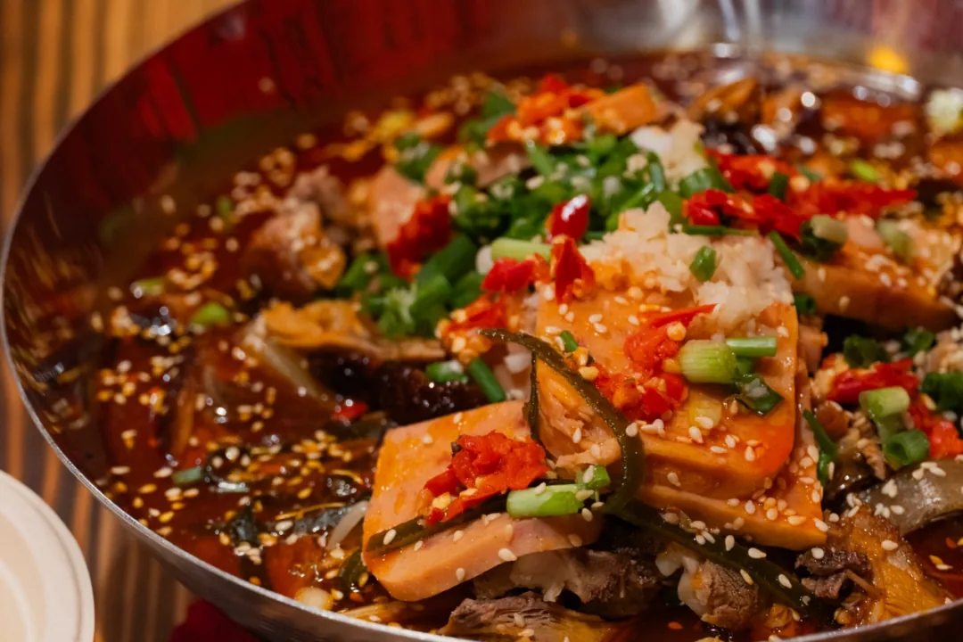 Bowl of mao kaoya with lotus root and bean jelly at Chengdu counting streets restaurant