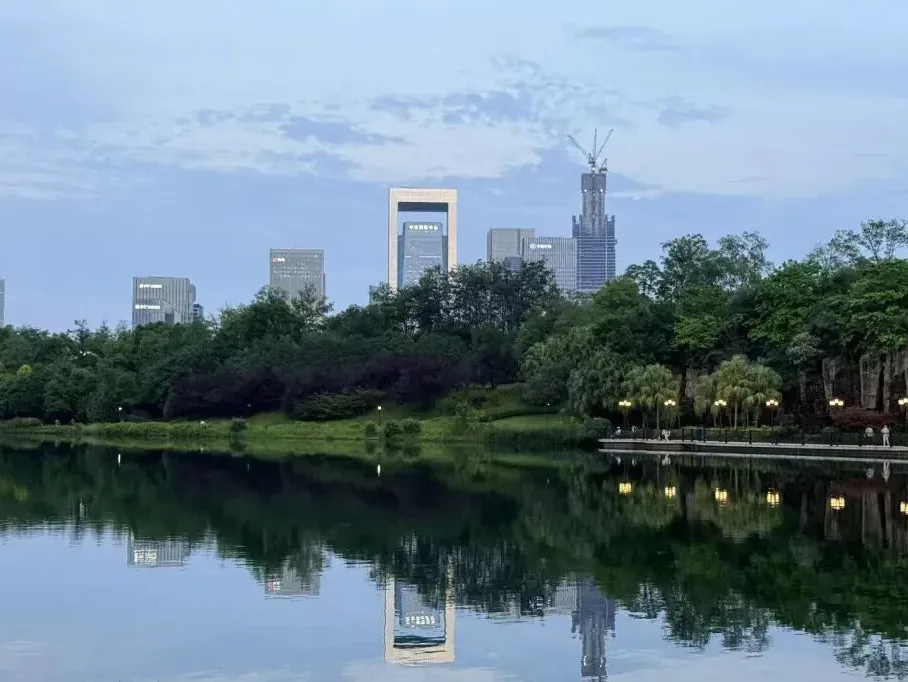 Evening view of Zhengxing Creek with lights reflecting on water