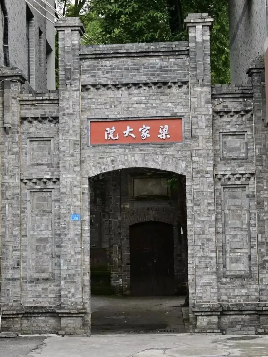 Peeking through the door crack at Liang Family Compound, sunlight on flagstones