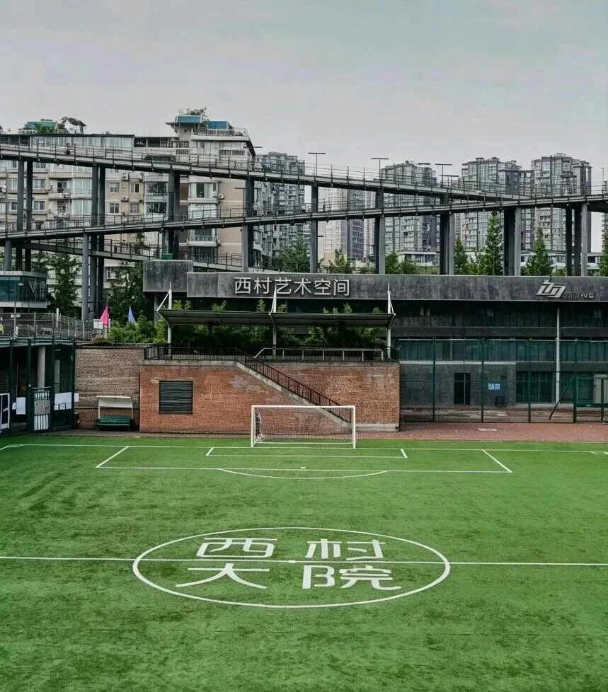 Elevated running track spiraling around a concrete building at West Village Chengdu