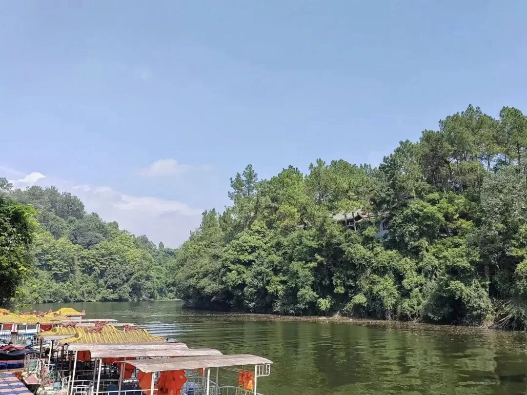 Huazhi Temple cliff carvings seen from the water approach by boat