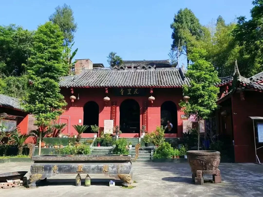 Simple rebuilt halls of Huazhi Temple nestled along the hillside