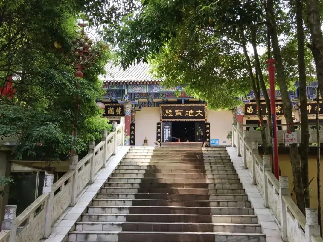 Tranquil path at Sanmei Shui temple complex in Pengzhou, perfect for quiet solo visits