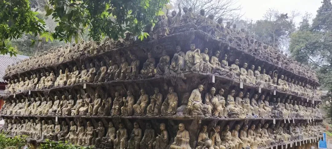 Hundreds of arhat statues densely arranged in the Ancient Resolving Grievances Cave