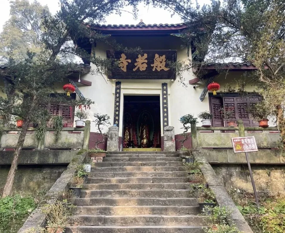 Bore Temple halls rising along mountain slope with traditional wooden architecture