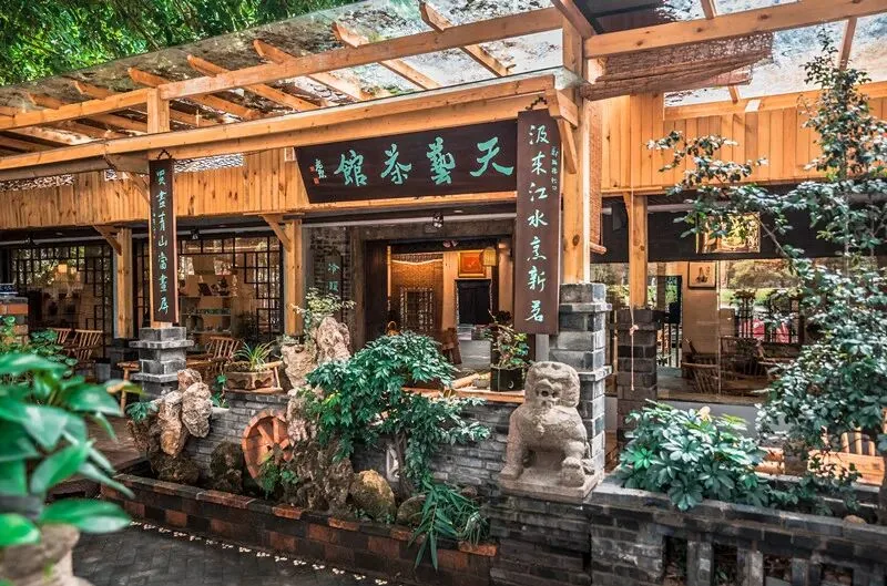 Sichuan garden details with gray tiles and raw wood at Nongyuan