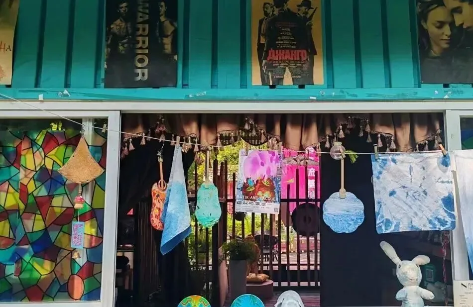 Plant-based indigo tie-dye workshop creating blue-and-white patterns
