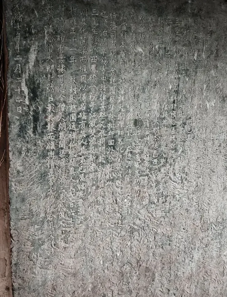 Exterior of Longzang Temple's ancient halls and stele pavilion in the rain