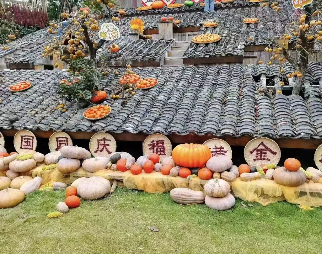 Autumn drying house roof with pumpkins, persimmons, chilis and corn