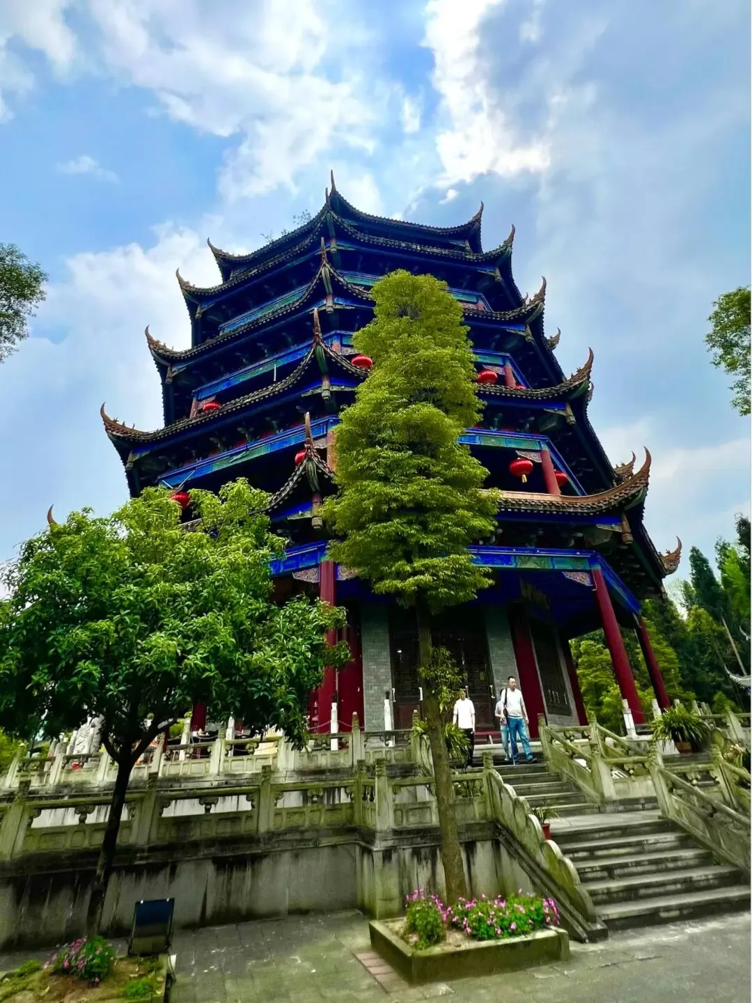 Stone archway and long stone steps leading up through bamboo at Yangping Xuanguan