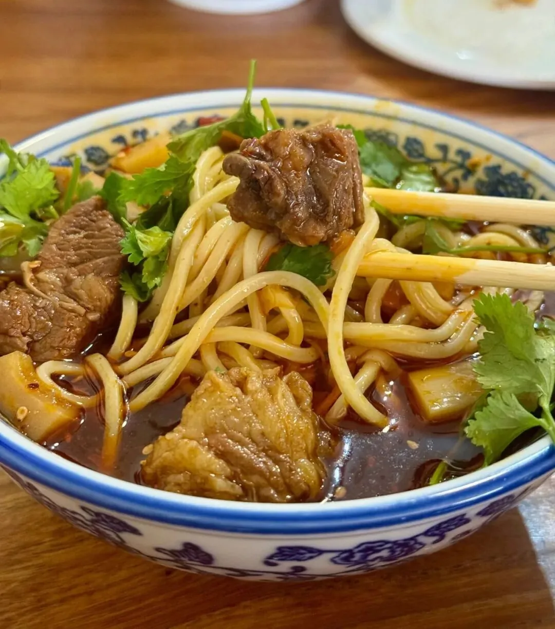 Beef noodles with rich original broth, fresh crisp bamboo shoots, and large clean beef chunks