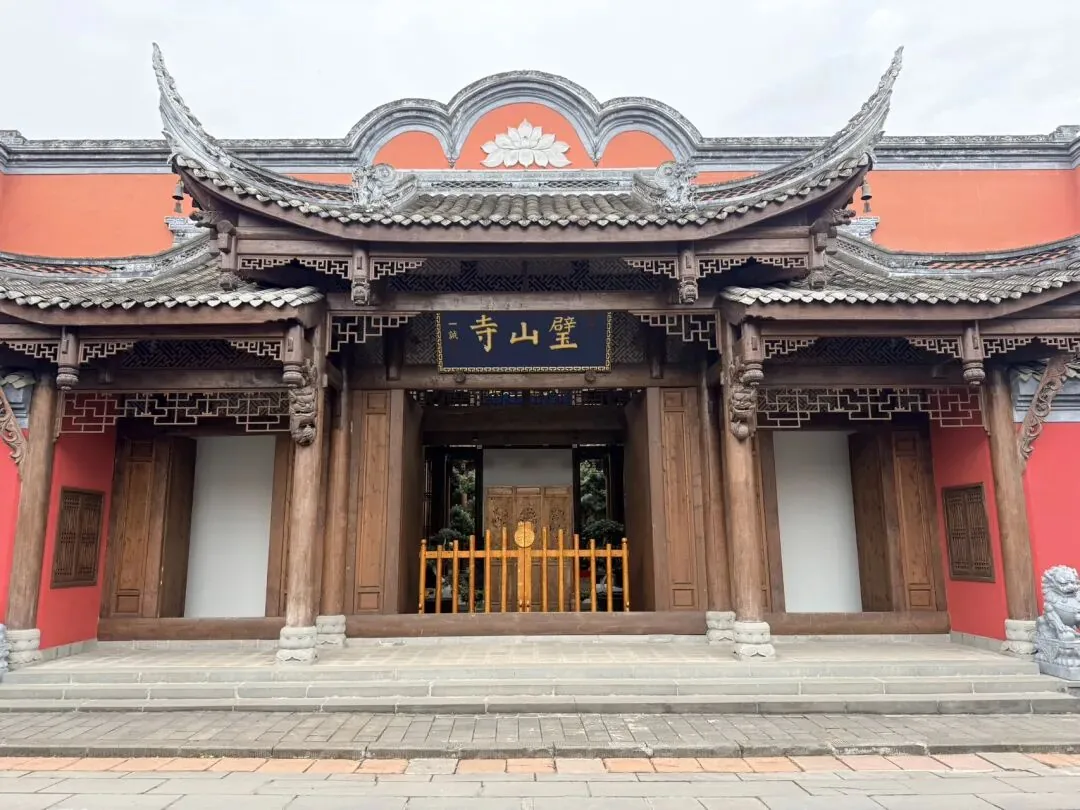 Bishan Temple in Xinchang Ancient Town with succulents and a stream