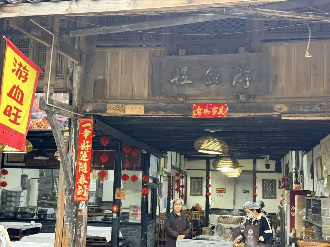 Local food in Anren Ancient Town, including blood curd and sweet water noodles