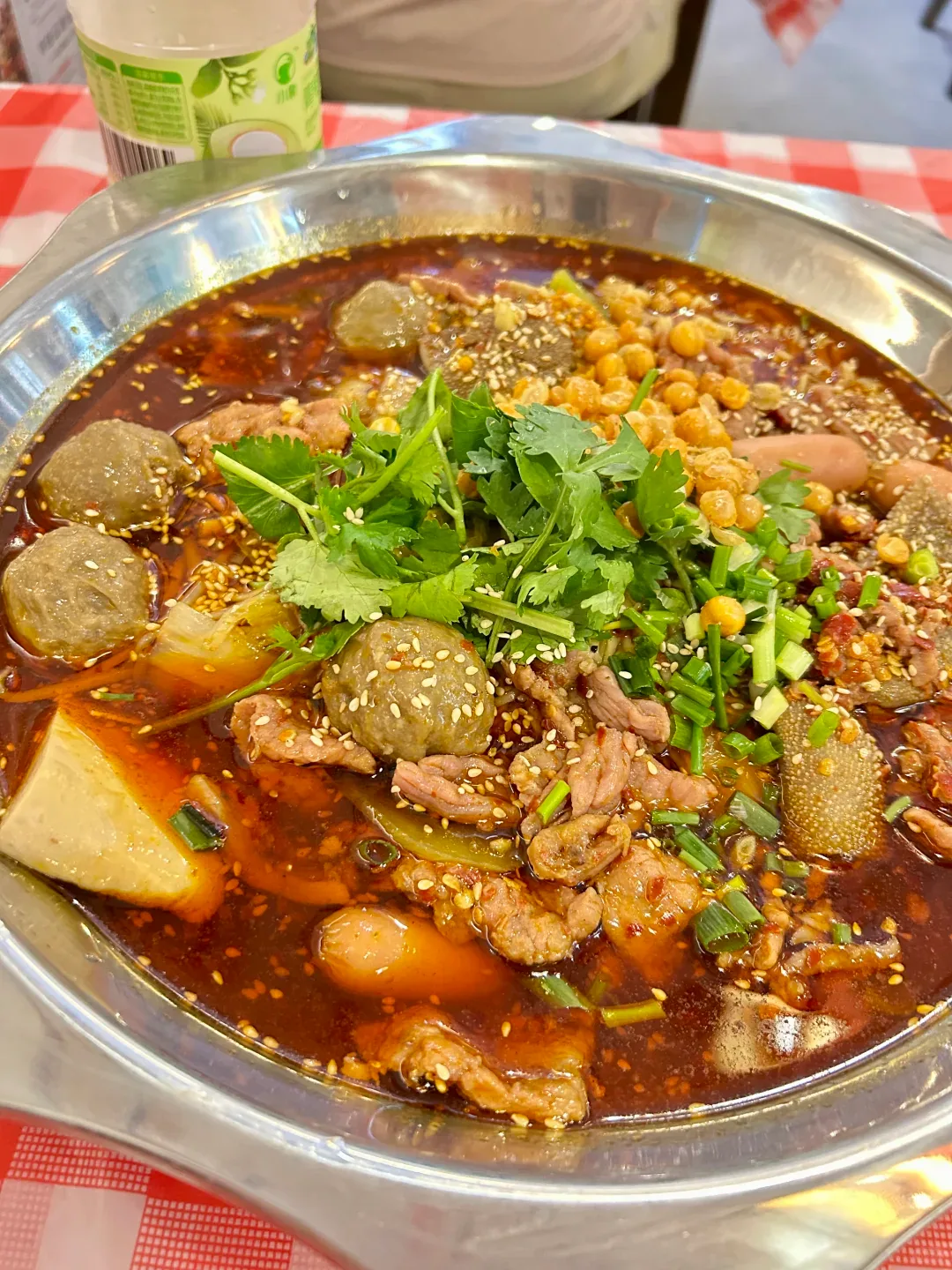 Red oil maocai in a bowl at a Chengdu neighborhood shop