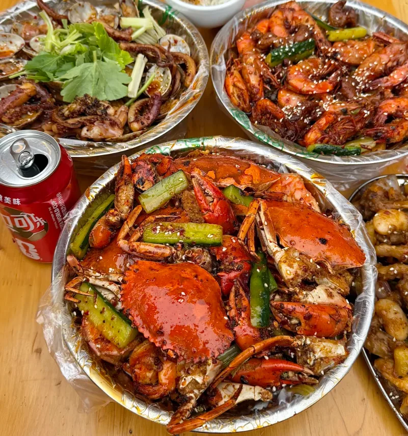 Pen pen shrimp in spicy red oil broth with celery and potato