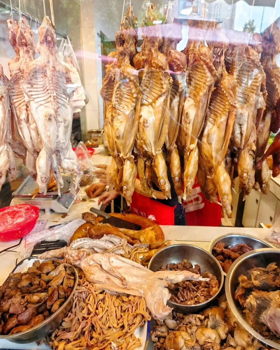 Long line of customers waiting at popular Chengdu brine shop